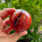 Looking for genuine and stunning Carnelian Crystal Sphere? Shop at Magic Crystals for polished cut base carnelian. We only carry 'AAA' Quality Carnelian from India and Madagascar. Red Agate Crystal Tower for reiki Healing. Free Standing Crystal, Beautiful Display Crystal with FREE SHIPPING AVAILABLE.