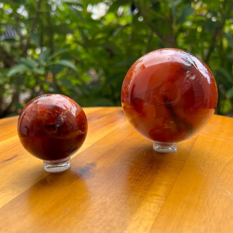 Looking for genuine and stunning Carnelian Crystal Sphere? Shop at Magic Crystals for polished cut base carnelian. We only carry 'AAA' Quality Carnelian from India and Madagascar. Red Agate Crystal Tower for reiki Healing. Free Standing Crystal, Beautiful Display Crystal with FREE SHIPPING AVAILABLE.