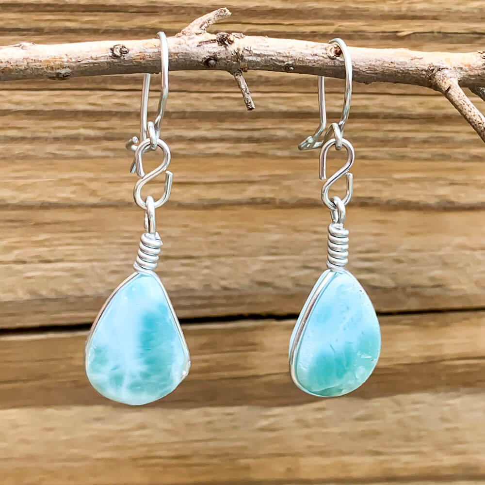 This lovely, rare and spectacular mineral gem called Larimar is a blue pectolite found in the Dominican Republic. Shop Genuine Blue Larimar Earrings set in Sterling Silver at Magic Crystals. We carry Larimar Teardrop Stone, Sterling Caribbean Larimar Earrings, Gift For Her, Gemstone Earrings and Dangle earrings.