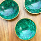 Buy Malachite Home decor? Shop at Magic Crystals for Genuine Malachite Round Bowl - Malachite from Congo, Circular Malachite Bowl with Gold Rim Great for Crystal Grids. malachite aesthetic, malachite jewelry, malachite stone, malachite crystal meaning. Malachite is known as a protection stone.