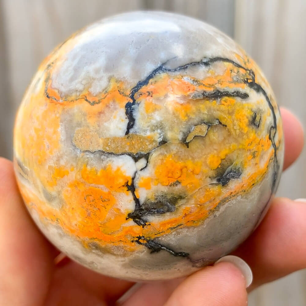 Looking for genuine gemstone spheres? bumble bee jasper? Magic Crystals carries Tumbled Bumblebee Jasper Sphere. This is one summertime Bumble Bee Jasper Sphere.  bumble bee jasper, polished jasper, bumble bee jasper sphere, tumbled stones, tumbled crystals. FREE SHIPPING available.