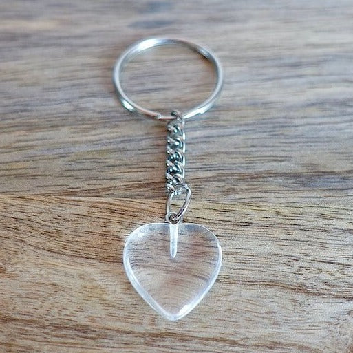 Clear Crystal Quartz keychain. Shop at Magic Crystals for Crystal Keychain, Pet Collar Charm, Bag Accessory, natural stone, crystal on the go, keychain charm, gift for her and him. Clear Crystal Quartz is a great for all hear. Clear Crystal Quartz Natural Stone Keychain, Crystal Keychain, Clear Crystal Quartz Crystal Key Holder. White clear gemstone.