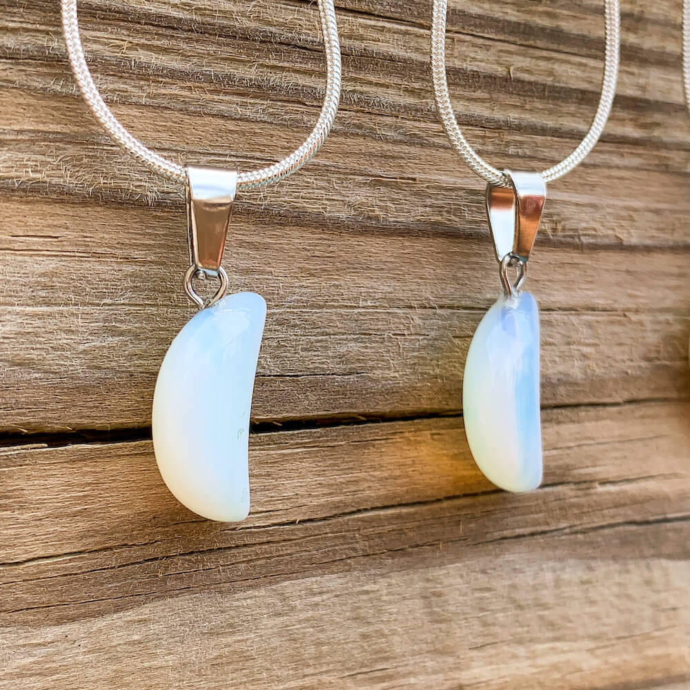 Looking for Opalite Jewelry? Find Opalite Stone Moon Pendant Necklace at Magic Crystals. Find the best selection of opalite pendants here at MagicCrystals.com Opalite stabilizes mood swings and helps in overcoming fatigue. Our Moon opalite gemstone pendant is a delightful way to enjoy the beauty and energy of crystals.