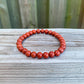 Looking for Red Jasper Jewelry? Shop at Magic Crystals for Red Jasper Beaded Bracelets. Natural Red Jasper Unisex Elastic Bracelet. Red jasper is a stone of physical strength, a vitality that can help with the stabilization of one’s energy. FREE SHIPPING available. Natural Healing Gemstone Buddha Charm Bracelet, red jasper earrings, and rings.