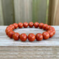 Looking for Red Jasper Jewelry? Shop at Magic Crystals for Red Jasper Beaded Bracelets. Natural Red Jasper Unisex Elastic Bracelet. Red jasper is a stone of physical strength, a vitality that can help with the stabilization of one’s energy. FREE SHIPPING available. Natural Healing Gemstone Buddha Charm Bracelet, red jasper earrings, and rings.