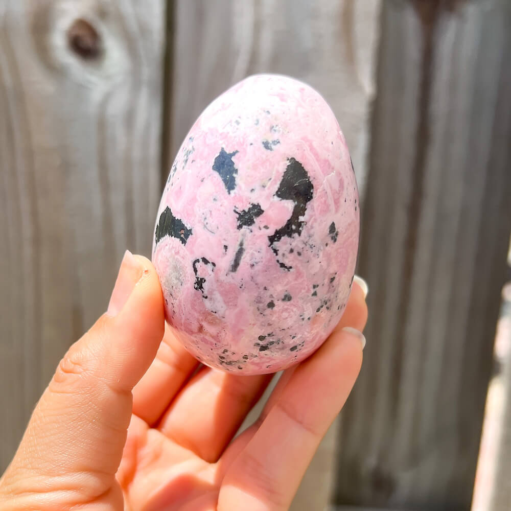 Shop for handmade Pink Rhodonite Egg -  Peruvian Rhodonite Carved Egg at Magic Crystals. Rhodonite Polished Egg Healing Crystal Gemstone. Rhodonite is a wonderfully peaceful crystal. Enjoy FREE SHIPPING when you shop at magiccrystals.com. Undrilled crystal egg. Undrilled Pink Egg.